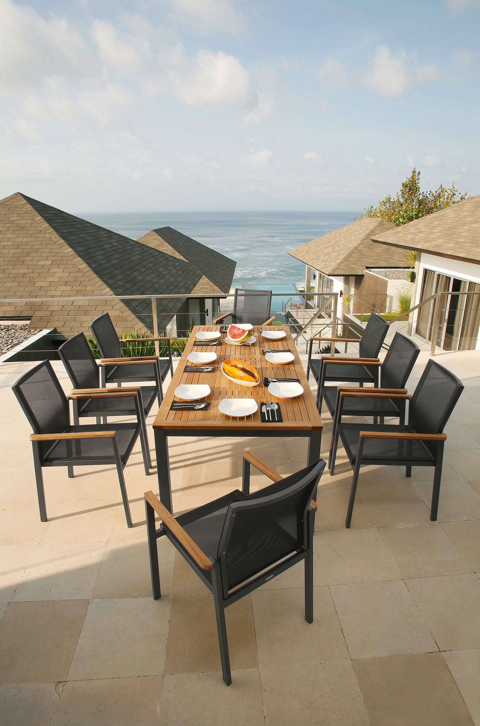 Barlow Tyrie Aura Teak and Aluminum Rectangular 79" Dining Table pictured with Aura Dining Armchairs