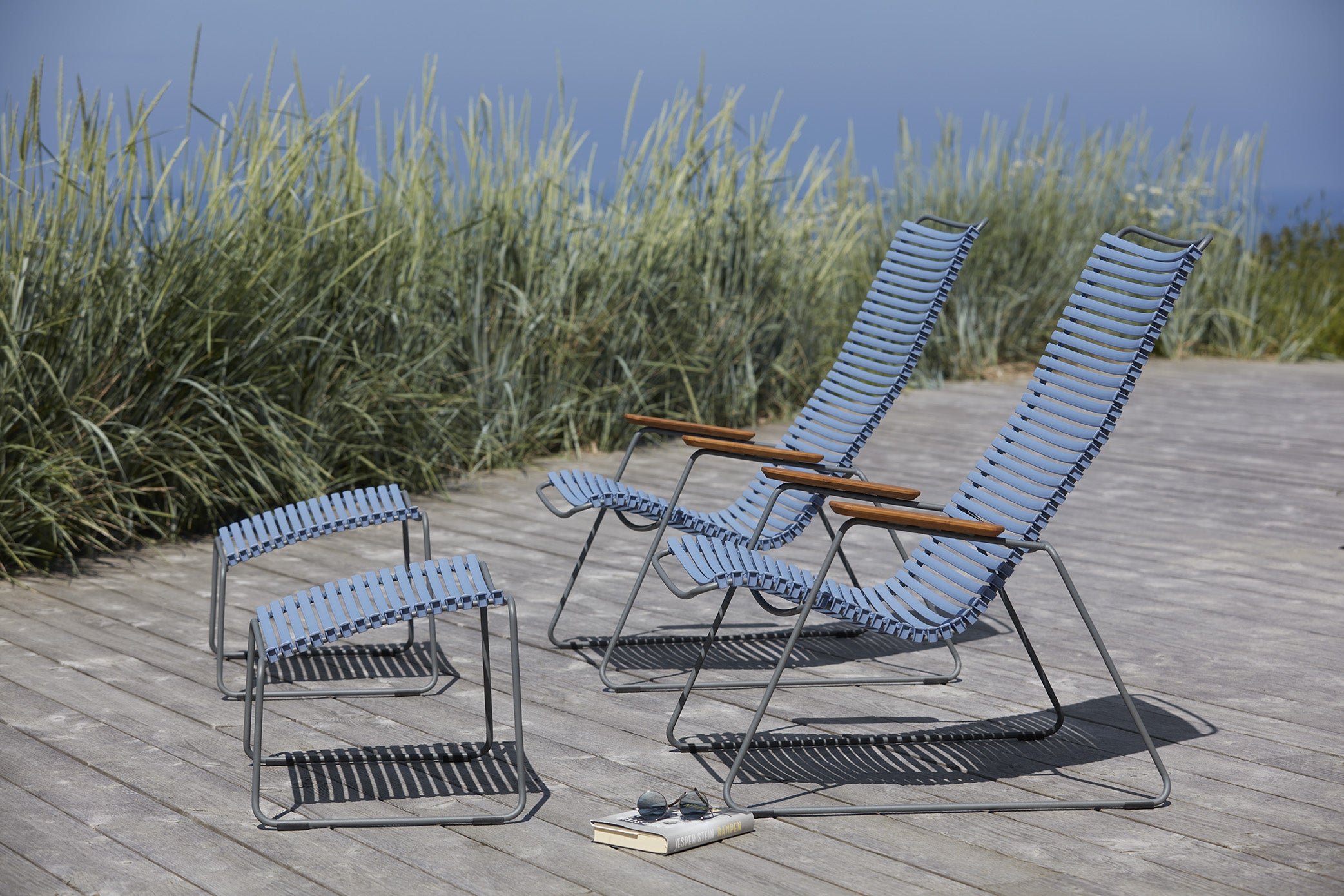 Click Lounge Chair pictured with an additional Click Lounge Chair in Pigeon Blue and 2 of the Click Footrests Item - HOU-10813 (sold separately)